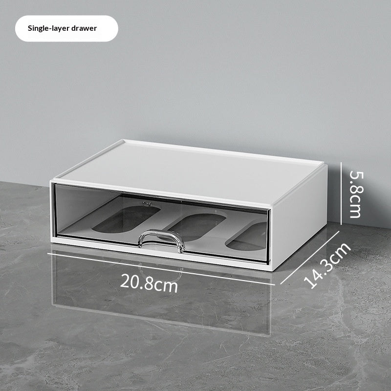 White single-layer desktop organizer with a transparent divided pull-out drawer